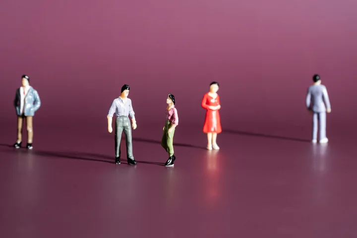 Small figures standing apart on a deep plum background, one set off alone